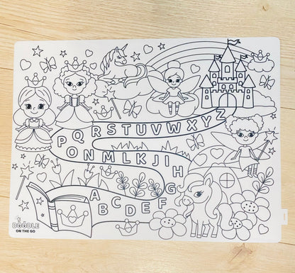 Coloring page with princesses, fairies, unicorns, and castles on a wooden surface.